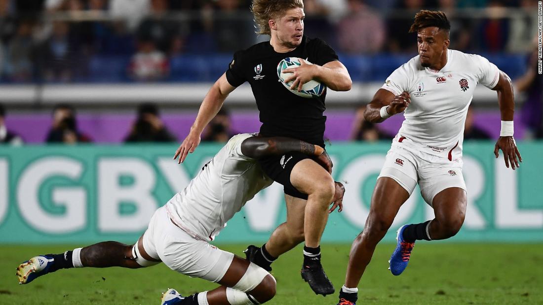 New Zealand&#39;s centre Jack Goodhue is tackled by Courtney Lawes as a dominant England trounces New Zealand 19-7 to reach its first World Cup final since 2007.