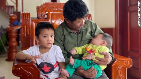 Le Minh Tuan and two of his grandchildren. Their father - Le&#39;s son - is believed to have died as he tried to make his way to the UK.