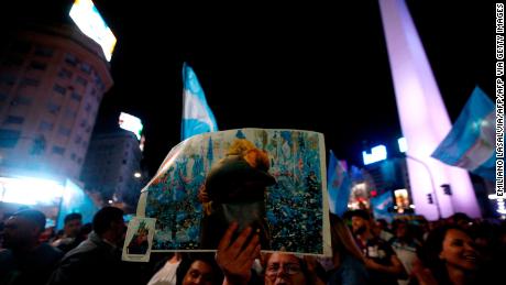 Supporters of Argentina&#39;s presidential candidate for the Frente de Todos party Alberto Fernandez celebrate his win in the general elections at Obelisco in Buenos Aires on October 27, 2019.