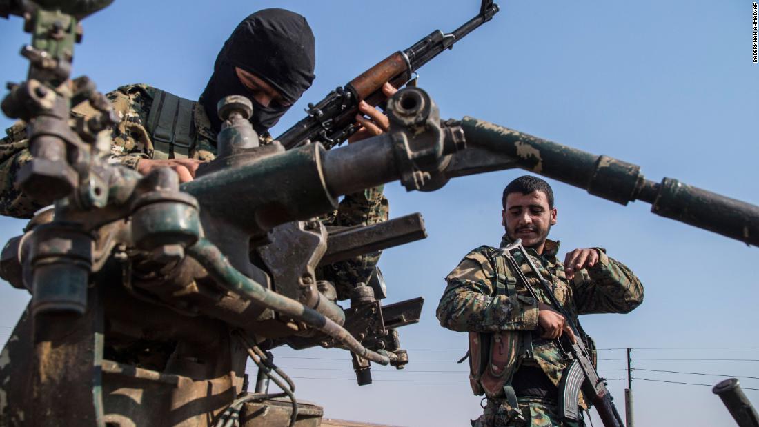 Kurdish forces withdraw from an area near the Turkish border with Syria on Sunday, October 27.
