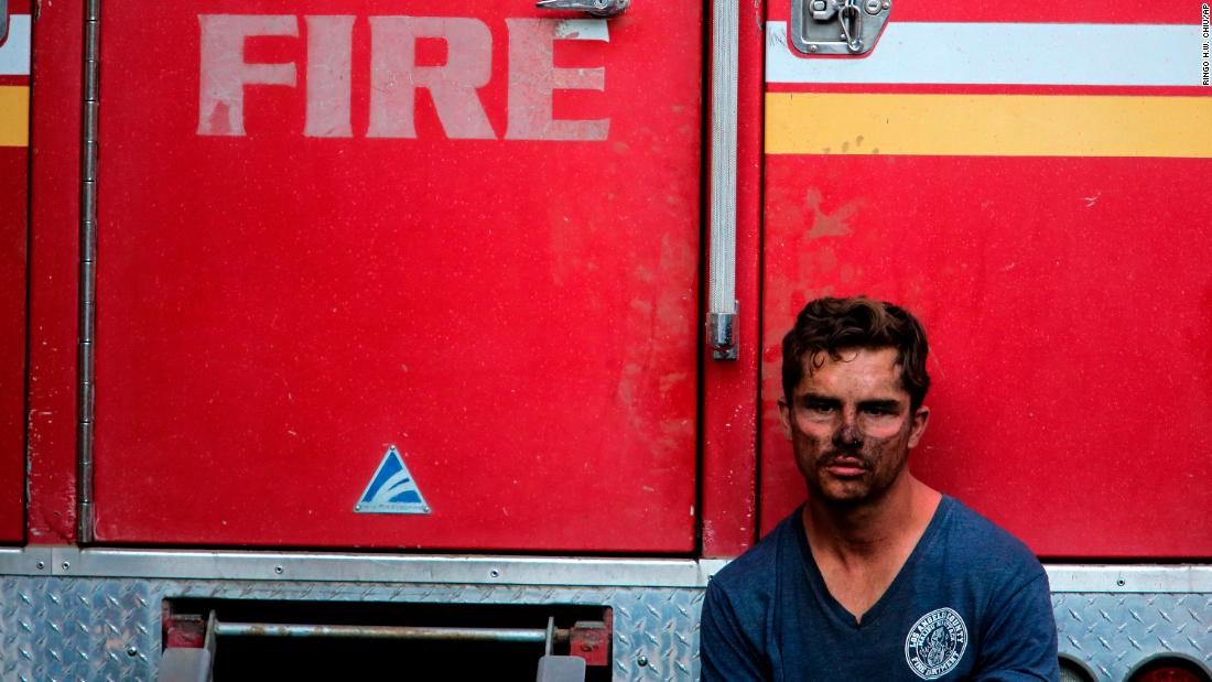 Los Angeles County firefighter Collin Bashara rests near his truck on October 28.