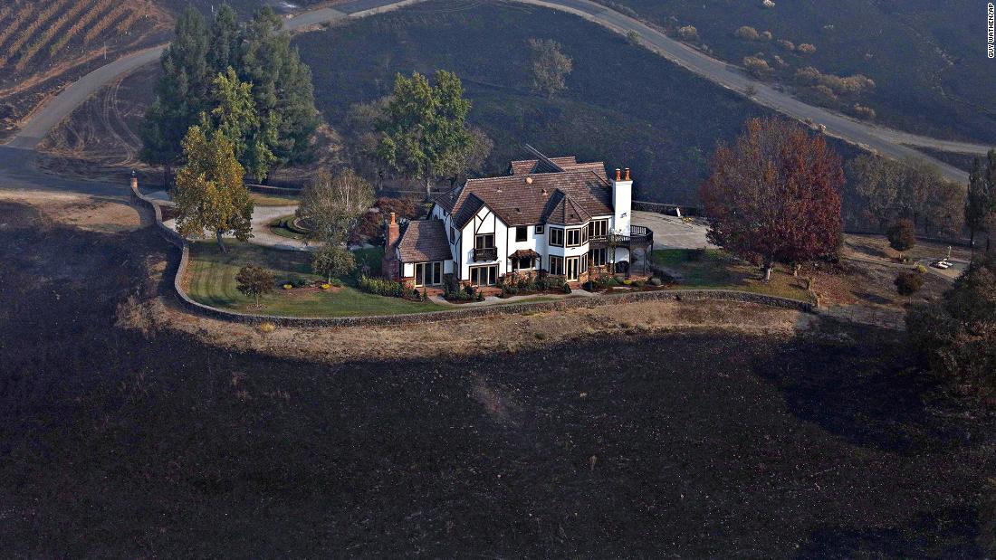 A home between Healdsburg and Windsor is surrounded by charred ground on October 29. 