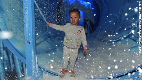 A child stands in a play area at during the Toys &quot;R&quot; Us Adventure Atlanta Opening on October 25, 2019 in Atlanta