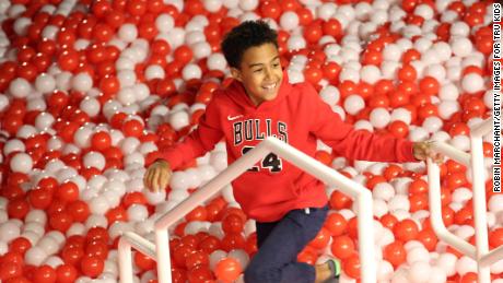 A child plays in a ball pit at Toys &quot;R&quot; Us Adventure Chicago Opening Preview on October 23, 2019 in Chicago
