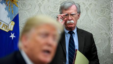 National security advisor, John Bolton, right, attends a meeting with President Donald Trump and President of Chile, Sebastian Piñera in the Oval Office of the White House on September 28, 2018 in Washington, DC.