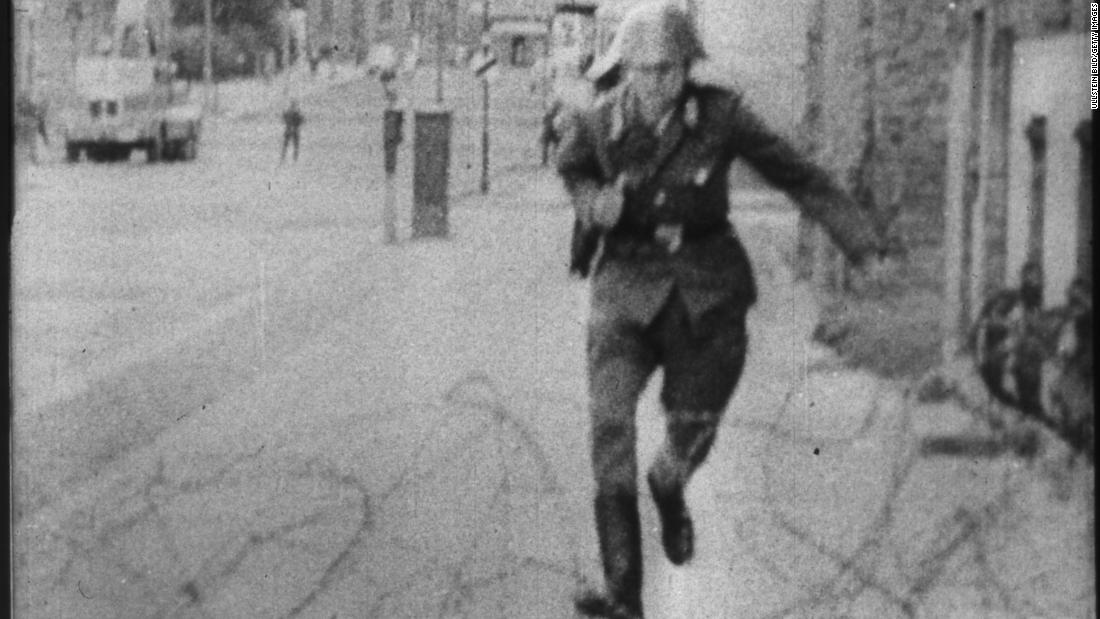 East German border guard Conrad Schumann&#39;s August 1961 escape over what was then a simple barbed wire barrier became one of the most memorable images of the Cold War era. 