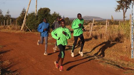 Mary Keitany (front left) trains her husband and coach Charles Koech (front right) in Iten, Kenya. 