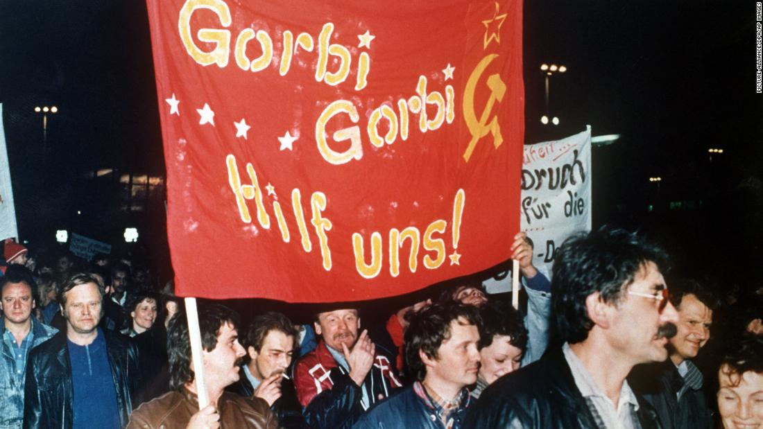 Protesters carry a banner reading &quot;Gorbi Gorbi help us!&quot; during a visit to East Germany by Mikhail Gorbachev -- then leader of the Soviet Union -- in October 1989.  