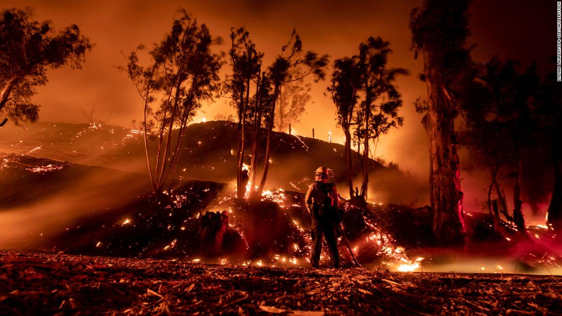 A firefighter works at containing the Maria Fire in the hills near Ventura, California, on November 1.