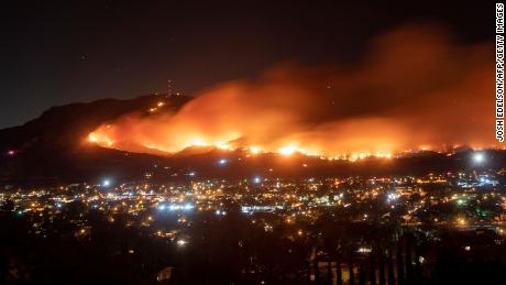 A long exposure photo shows the Maria Fire as it races across a hillside in Santa Paula, California, on November 1, 2019.