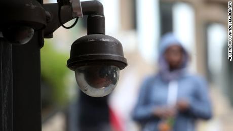 A video surveillance camera hangs from the side of a building on May 14, 2019 in San Francisco, California.