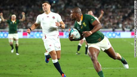 Makazole Mapimpi of South Africa breaks through to score his team&#39;s first try during the Rugby World Cup final.