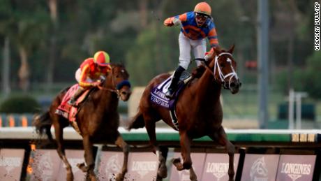 Irad Ortiz Jr. aborad Vino Rosso celebrates after the Breeders&#39; Cup Classic horse race at Santa Anita Park, Saturday, Nov. 2, 2019, in Arcadia, Calif. (AP Photo/Gregory Bull)