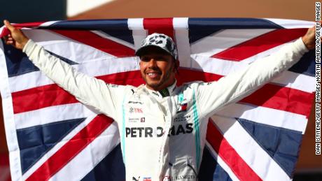 Britain&#39;s Lewis Hamilton celebrates in parc ferme after clinching his sixth Formula One world title.