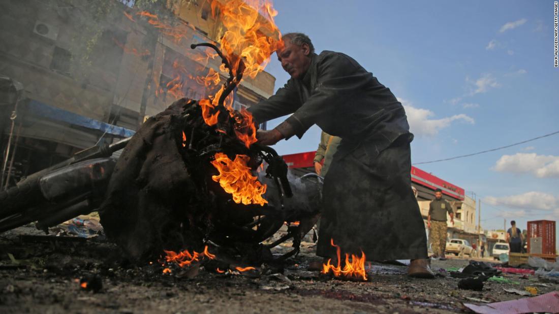 A man stands next to a burning motorcycle at the site of &lt;a href=&quot;https://www.cnn.com/2019/11/02/middleeast/tal-abyad-syria-car-bomb-explosion/index.html&quot; target=&quot;_blank&quot;&gt;a deadly car bomb explosion&lt;/a&gt; in Tal Abyad, Syria, on Saturday, November 2. Turkey&#39;s defense ministry blamed the Kurdish People&#39;s Protection Units and the Kurdistan Workers Party, while a group aligned with the Kurds blamed Turkey.