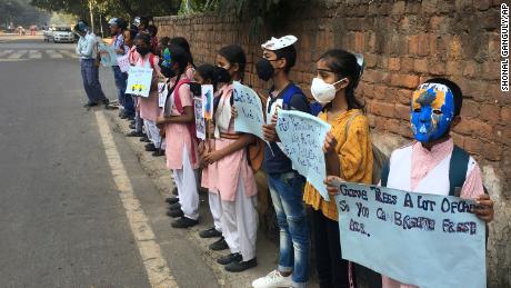 Schoolchildren protest outside the Indian Environment Ministry against alarming levels of pollution in New Delhi, India, on November 5, 2019. 