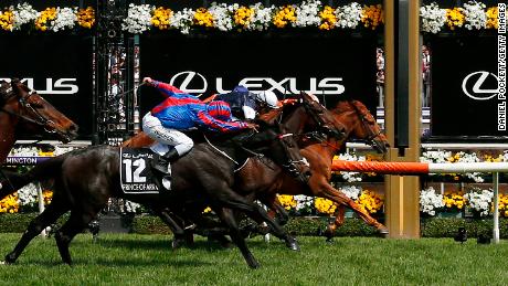 Craig Williams rides Vow and Declare (right) to win the 2019 Lexus Melbourne Cup at Flemington.