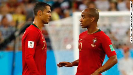 Portugal&#39;s forward Cristiano Ronaldo (L) speaks with Portugal&#39;s midfielder Joao Mario during the Russia 2018 World Cup Group B football match between Iran and Portugal at the Mordovia Arena in Saransk on June 25, 2018. (Photo by Jack GUEZ / AFP) / RESTRICTED TO EDITORIAL USE - NO MOBILE PUSH ALERTS/DOWNLOADS        (Photo credit should read JACK GUEZ/AFP via Getty Images)