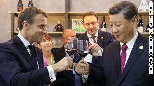 Chinese President Xi Jinping and French Emmanuel Macron (taste wine as they visit France&apos;s pavilion during the China International Import Expo in Shanghai on November 5, 2019.