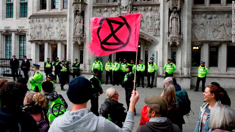 Climate activists protest outside the Supreme Court, during the eleventh day of demonstrations by the climate change action group Extinction Rebellion, in London, on October 17, 2019.