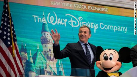 Bob Iger and Mickey Mouse look on before ringing the opening bell at the New York Stock Exchange in November 2017, marking the company&#39;s 60th anniversary as a publicly-traded company. (Drew Angerer/Getty Images)