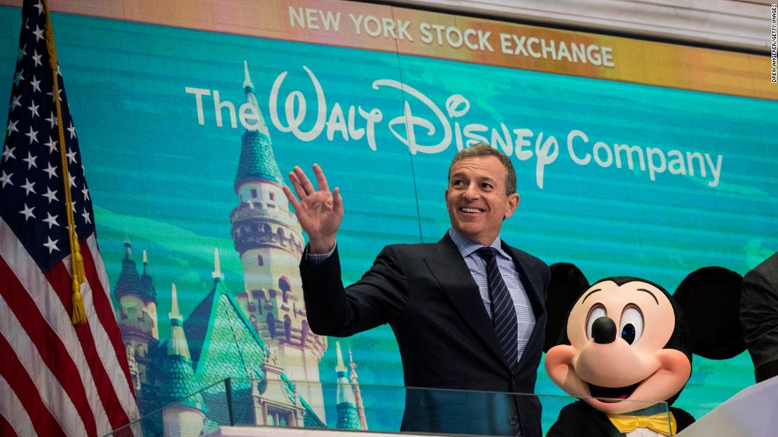 Bob Iger and Mickey Mouse look on before ringing the opening bell at the New York Stock Exchange in November 2017, marking the company&#39;s 60th anniversary as a publicly-traded company. (Drew Angerer/Getty Images)