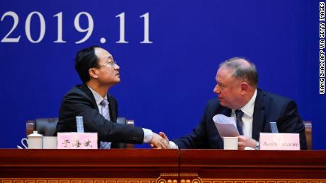 Yu Haibin (L), deputy director of China National Narcotics Control Commission shakes hands with Austin Moore, US Department of Homeland Security and Immigration and Customs Enforcement attache to China, on November 7.