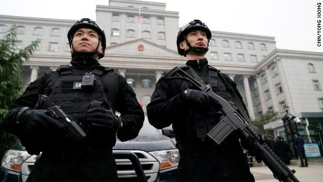 Two guards stand outside the Xingtai Intermediate People&#39;s Court in Hebei Province on Thursday November 7.