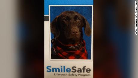 A very good service dog scored a spot in her Arkansas elementary school yearbook