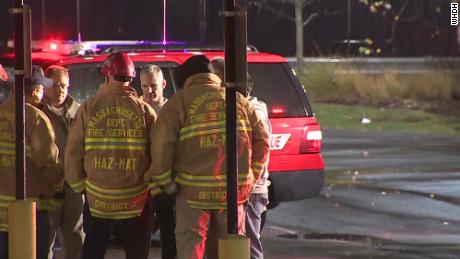 Firefighters gather outside the restaurant on Thursday evening.