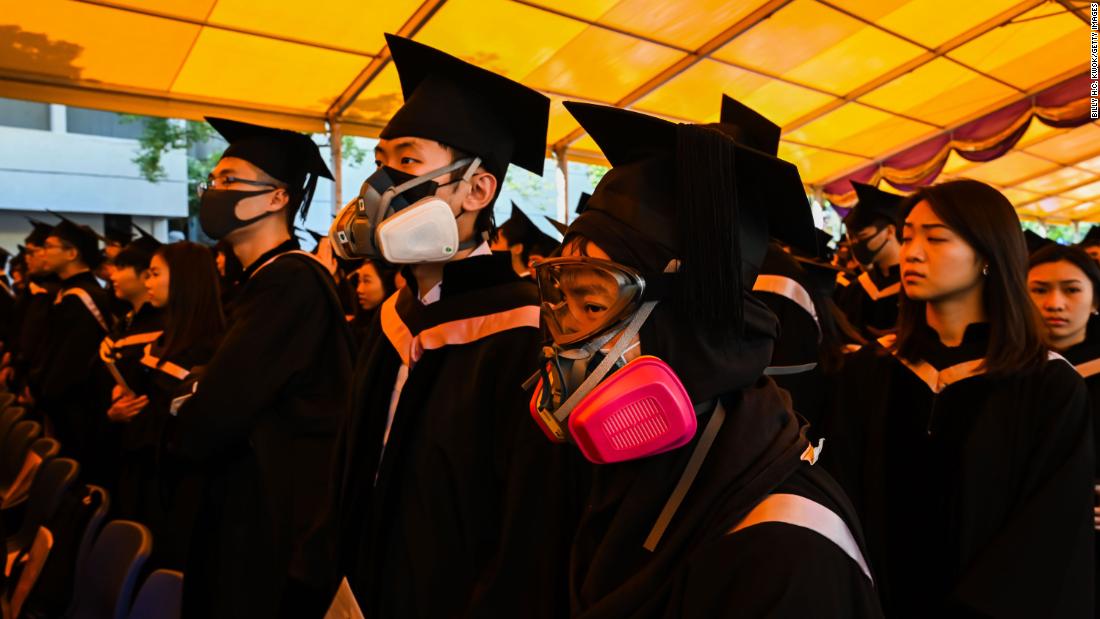 Students in gas masks are seen during a graduation ceremony at the Chinese University of Hong Kong on Thursday, November 7 in Hong Kong.