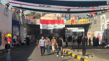 Protesters walk through the tunnel under Tahrir Square full of murals drawn by protesters and artists over recent weeks.