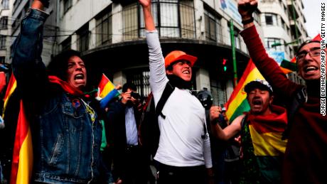 People take to the streets of La Paz to celebrate the resignation of Bolivian President Evo Morales on November 10, 2019.