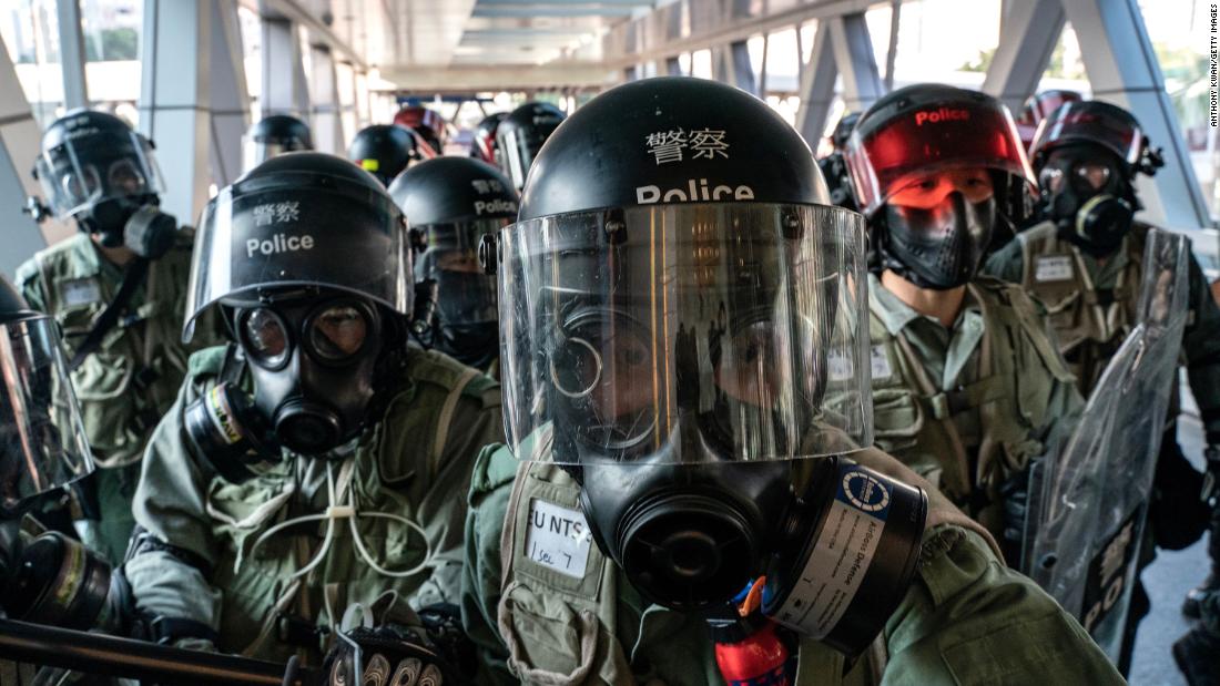Riot police face off with protesters at an entrance of a shopping mall during a demonstration on November 10.