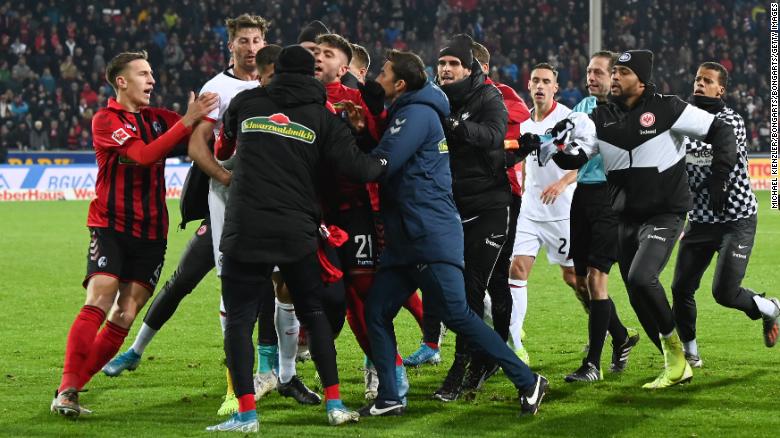 A scrap breaks out at the end of the Bundesliga match between Frankfurt and Freiburg. 