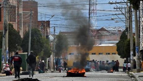 Pro-Evo Morales protesters block a street of El Alto on November 11, 2019, a day after the resignation of the leftist leader as president of Bolivia. 