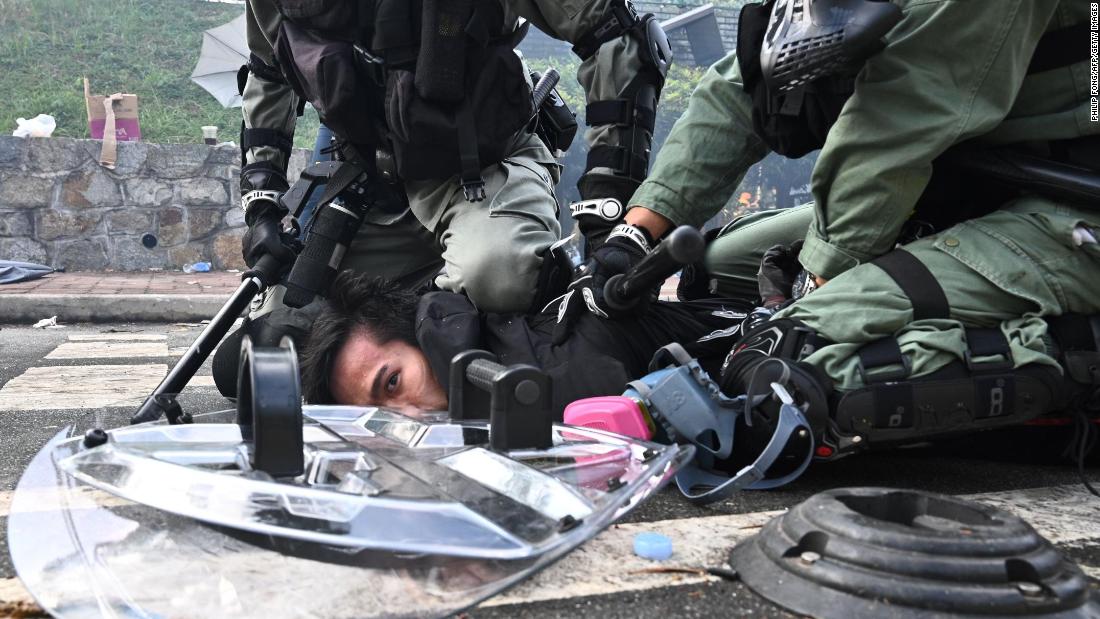 A man is detained during a protest at the Chinese University of Hong Kong on November 12.