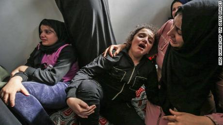 Lian (C) daughter of Baha Abu Al-Ata mourns during his funeral in Gaza City on November 12.