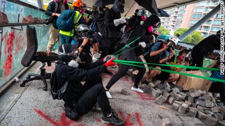 Protesters use a catapult against police during a protest Hong Kong&#39;s City University on November 12, 2019 following a day of pro-democracy protests.