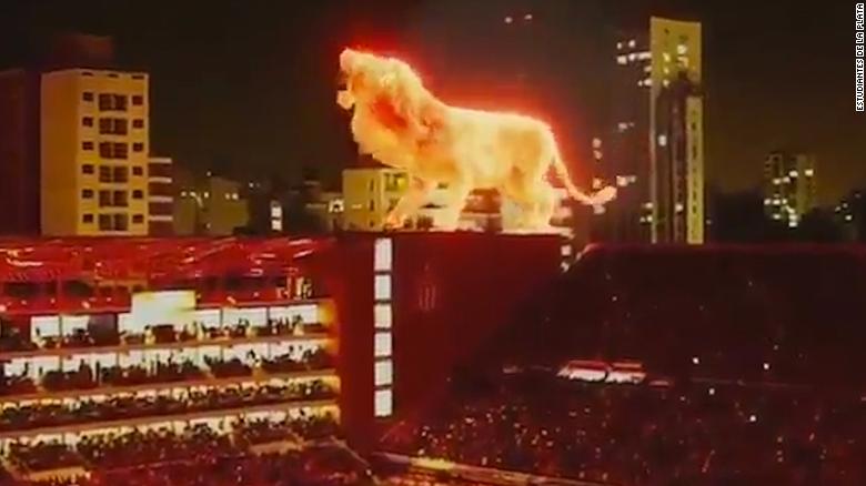 Fiery Lions And Disappearing Rappers Holograms In Sports Events