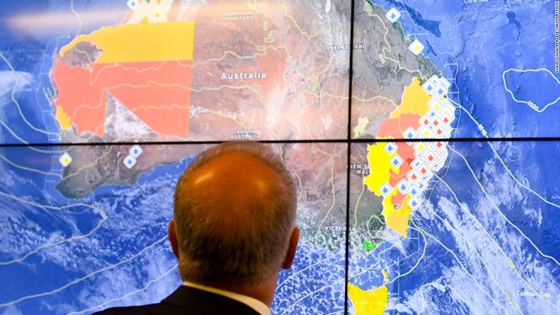 Australian Prime Minister Scott Morrison looks at a screen as he gets a briefing on the bushfire situation on November 12.