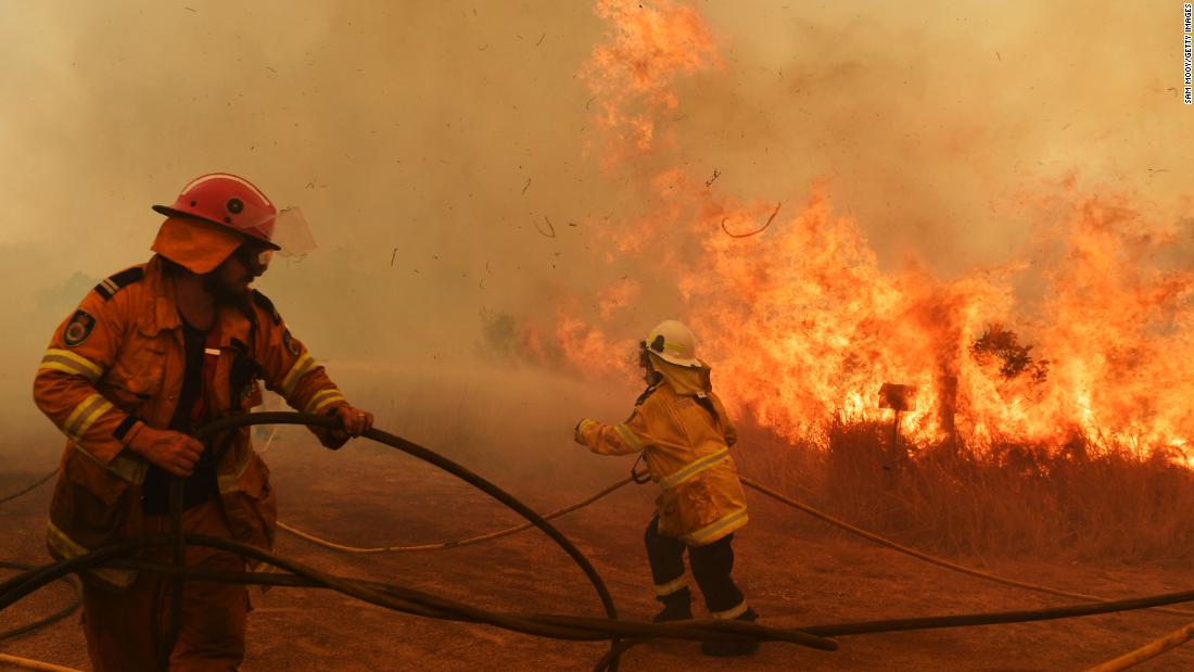 Firefighters battle a spot fire in Hillville on November 13.