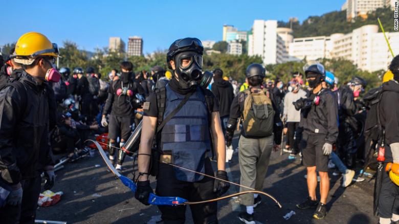 A protester armed with a bow is seen at the Chinese University of Hong Kong campus in Sha Tin on November 13, 2019. 