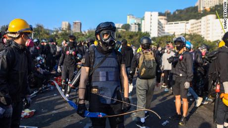 A protester armed with a bow is seen at the Chinese University of Hong Kong campus in Sha Tin on November 13, 2019. 