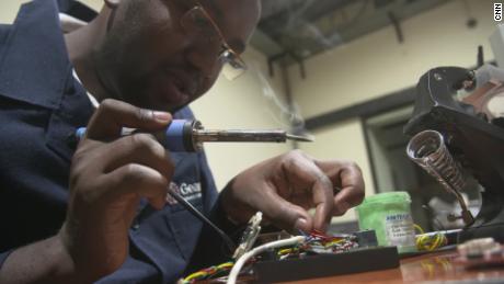 Nicholus Kimali tinkering with a speed governor.