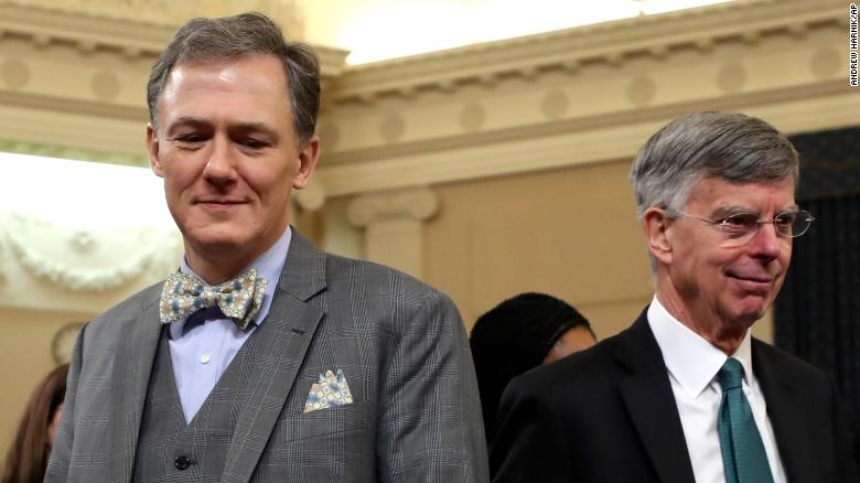 Top U.S. diplomat in Ukraine William Taylor, and career Foreign Service officer George Kent, left, walk back from a break as they testify before the House Intelligence Committee on Capitol Hill in Washington, Wednesday, Nov. 13, 2019.