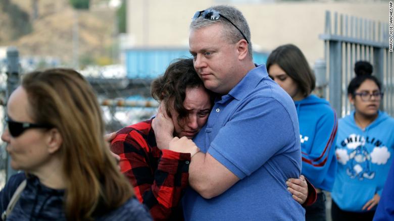 Students are escorted out of Saugus High School on Thursday after reports of a shooting. 