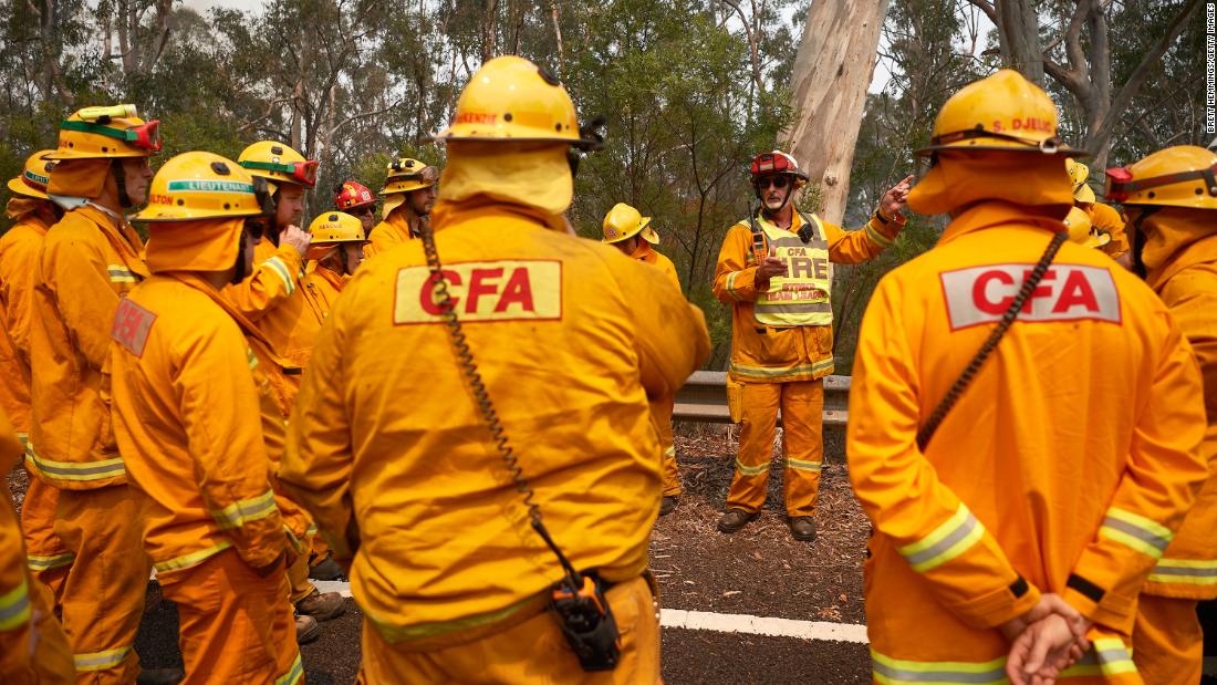 Firefighters organize their crews prior to working on controlled back burns in Sydney on November 14.