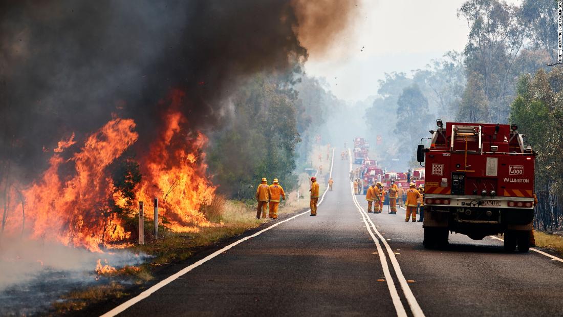 Firefighters work on controlled back burns on November 14.