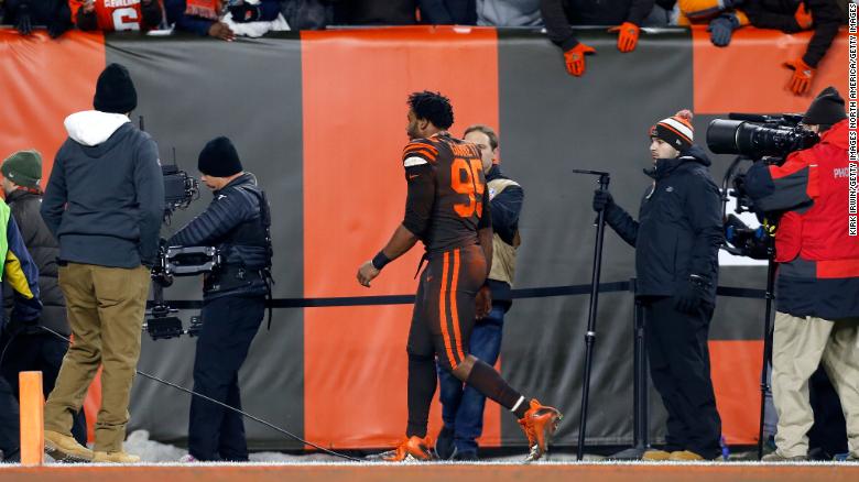 Garrett walks off of the field after being ejected.